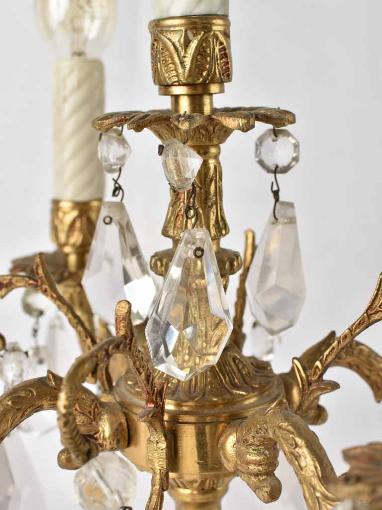 Antique bronze girandole with glass pendants