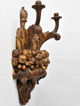 Classic imagery carved wood sconces