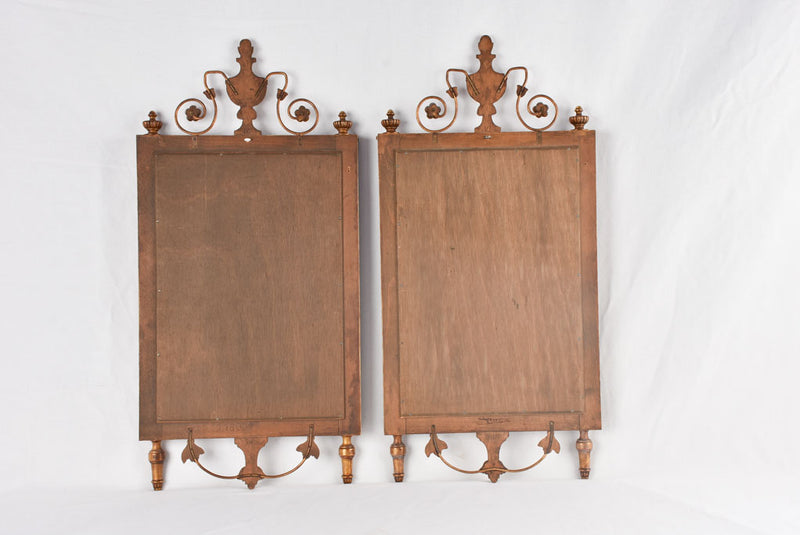 Sophisticated urn-decorated gilded mirrors
