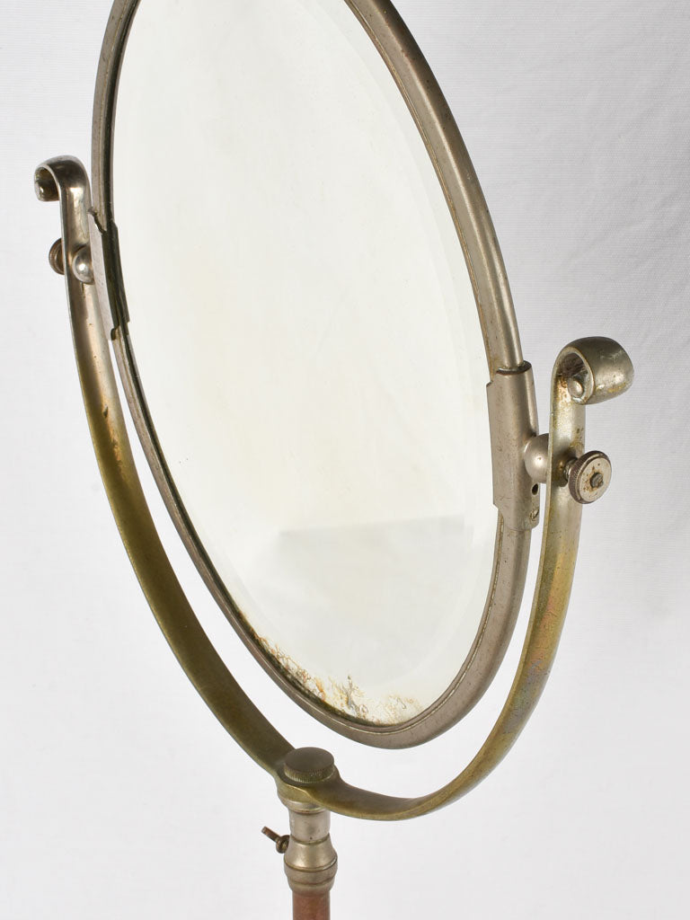 Elegant tilting oval dressing room mirror