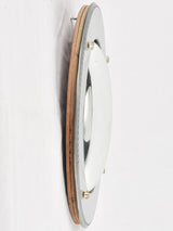 Sophisticated aged-finish round butler's mirror