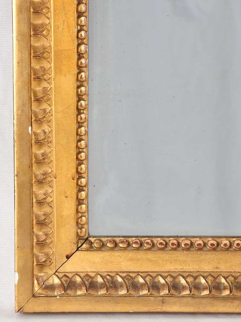 Stunning shiny-gilded Louis XVI mirror