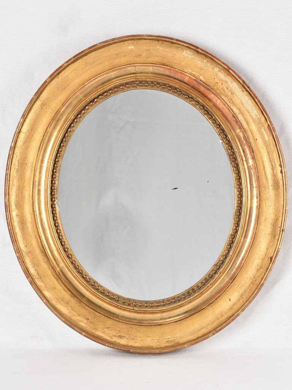 Small oval mirror w/ gilded frame & beading 17¾" x 15¾"