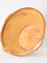 Large antique French bowl with yellow ochre glaze 19"