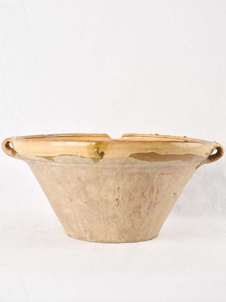 Large antique French bowl with ochre glaze 18"