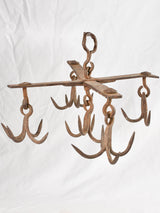 Antique wrought iron hooks display