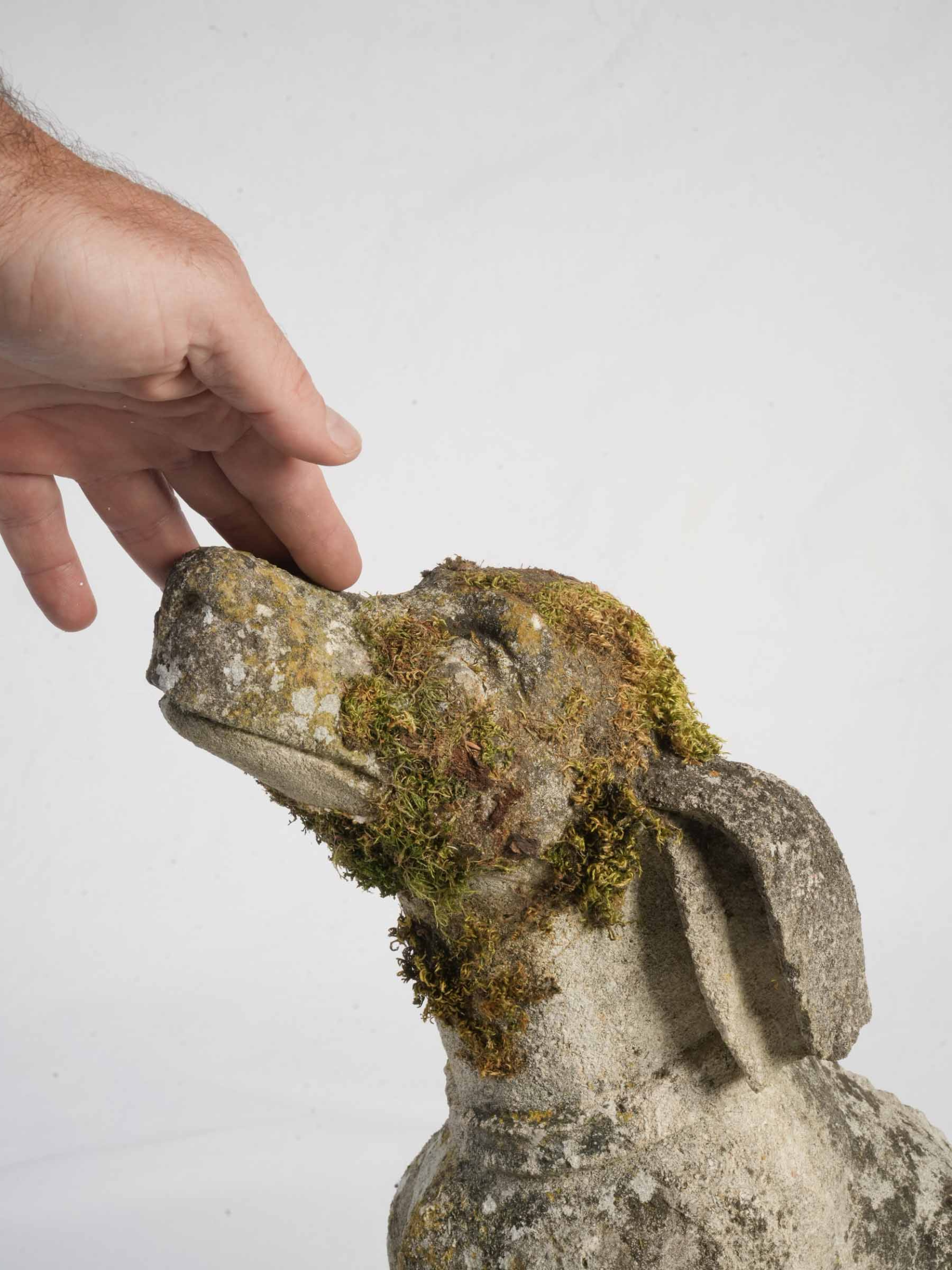 Weathered ancient stone garden statue  