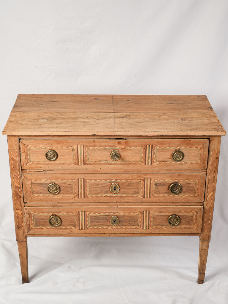 Refined marquetry ribbon motif commode  