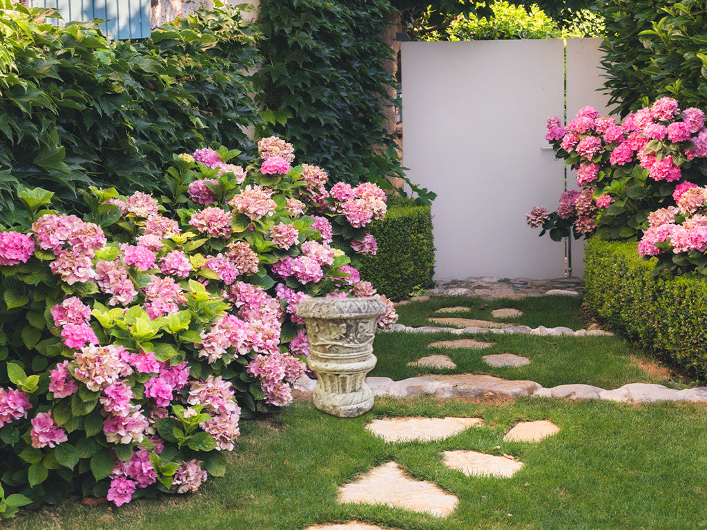 Weathered mossy limestone planter