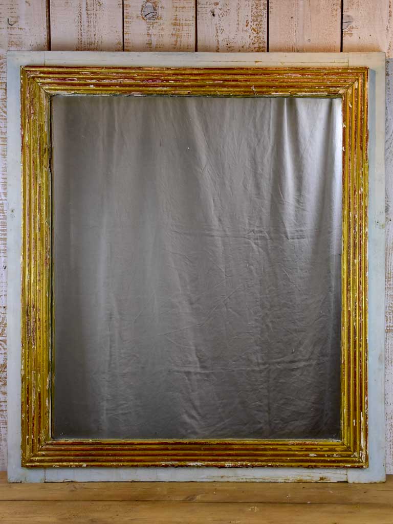 Large rustic Louis XVI mirror with reeded frame and blue gray border 44½" x 39½"