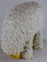 Vintage sculpture of a grazing sheep