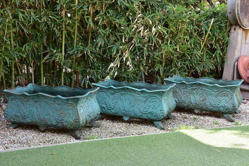 Two antique cast iron French garden planters with green finish