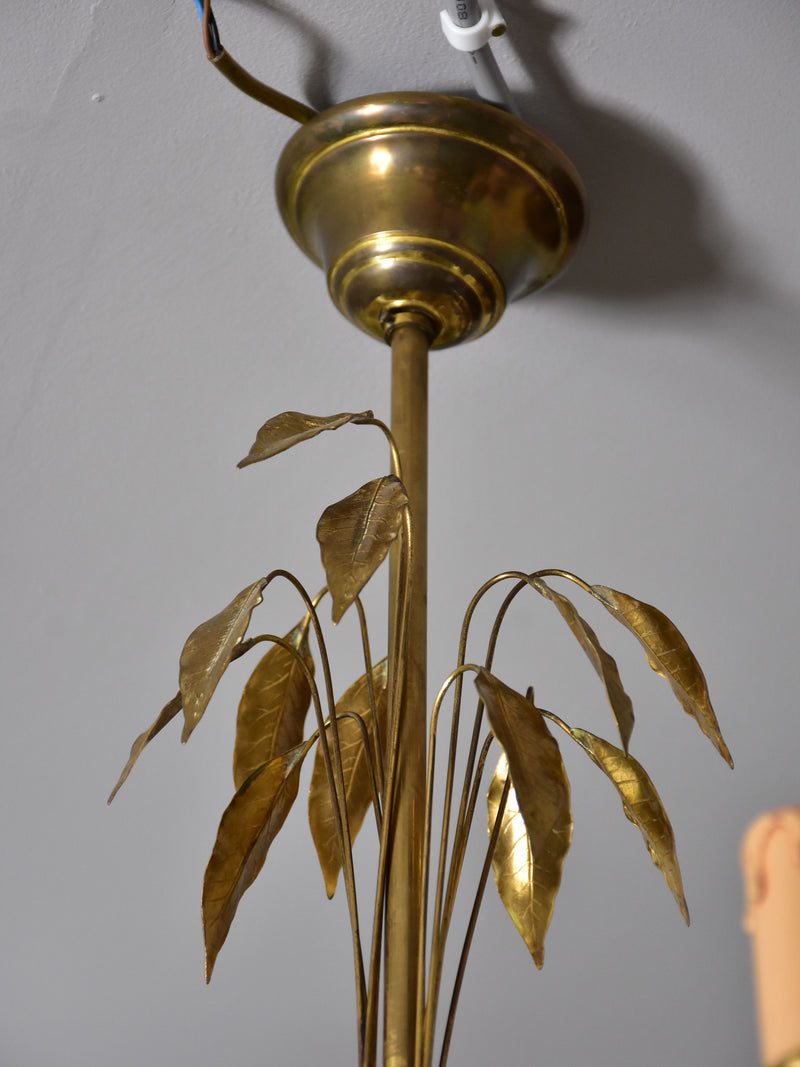 Pair of Maison Charles lustres with bay leaf detail
