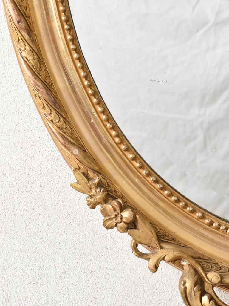 Aged Louis XV-style ornate mirror