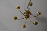 Pair of Maison Charles lustres with bay leaf detail