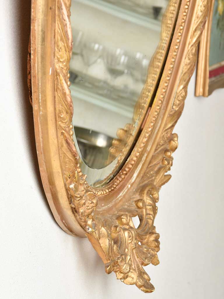 Vintage oval mirror with gold accent