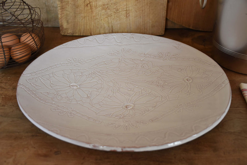 Large round platter with flower pattern