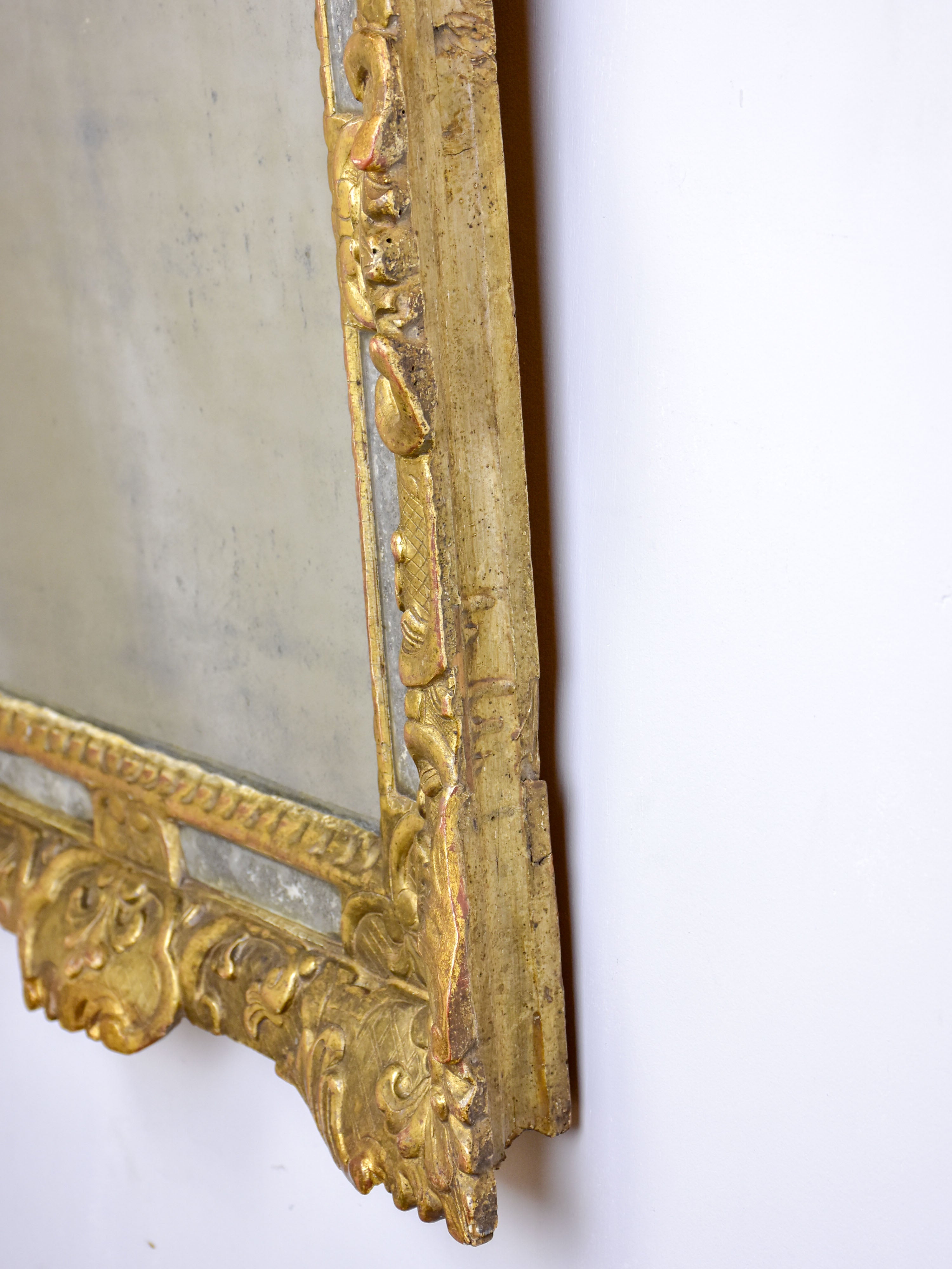 18th Century French mirror with gilded frame and aged glass 26” x 22 ½''