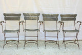 Four antique French iron and timber slatted garden armchairs