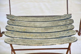 Four antique French iron and timber slatted garden armchairs