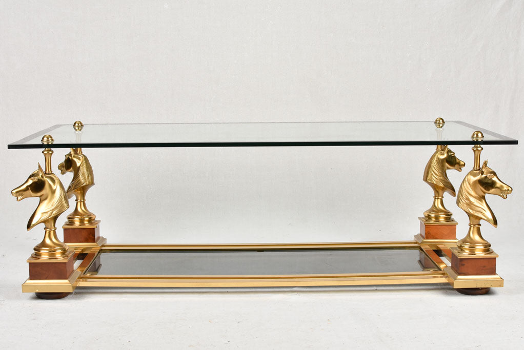 1970s glass coffee table with horse heads 47¾"