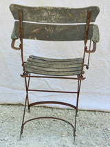 Four antique French iron and timber slatted garden armchairs