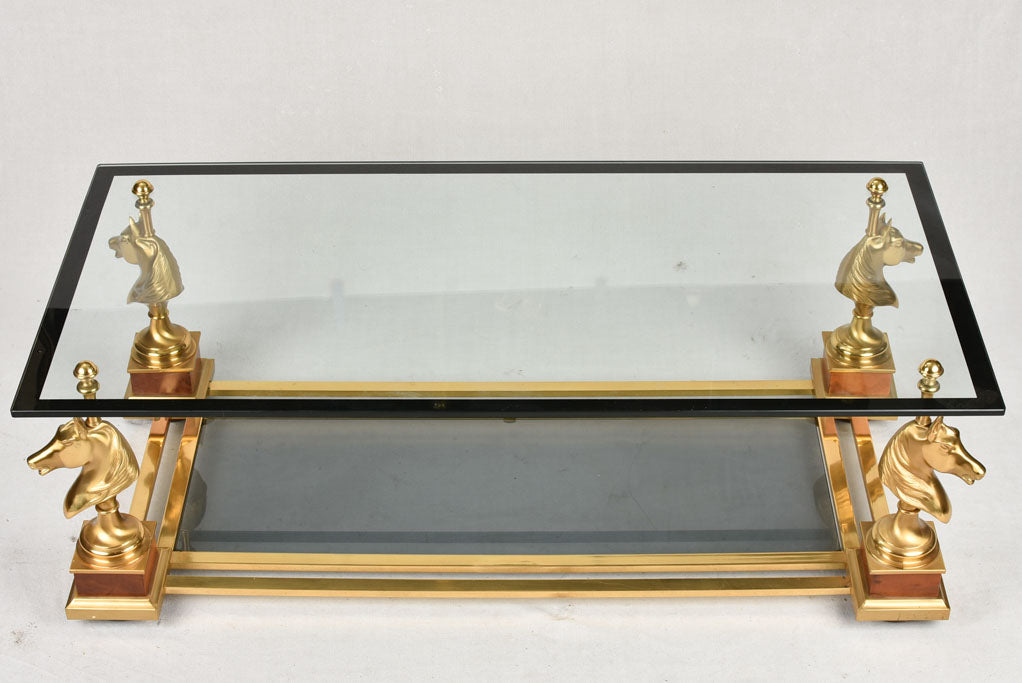 1970s glass coffee table with horse heads 47¾"