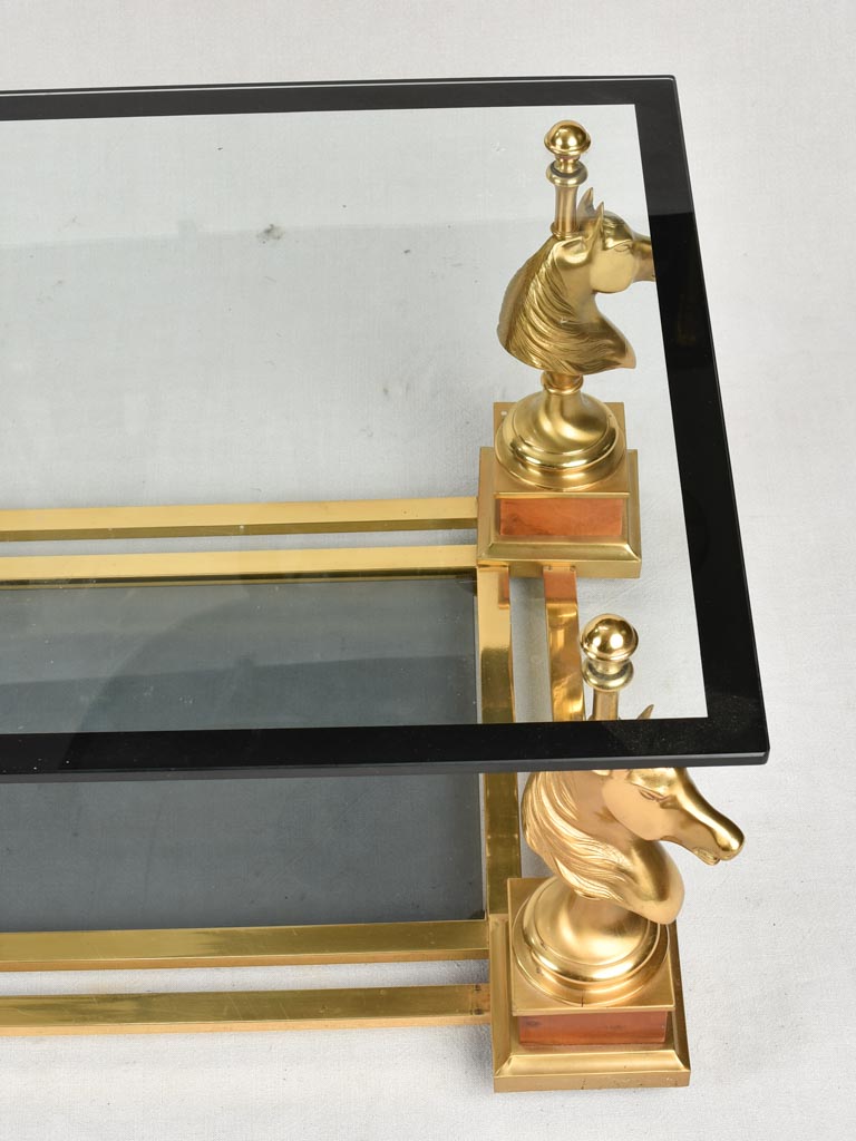 1970s glass coffee table with horse heads 47¾"