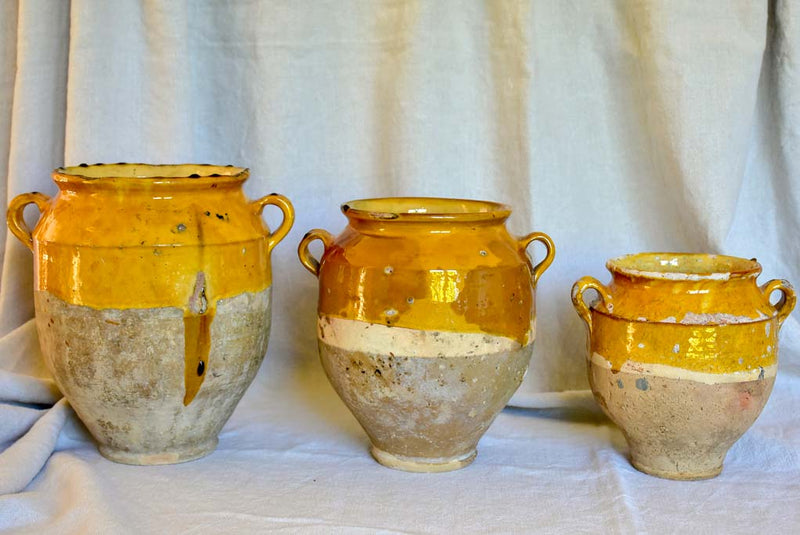 Collection of three antique French confit pots with ochre glaze