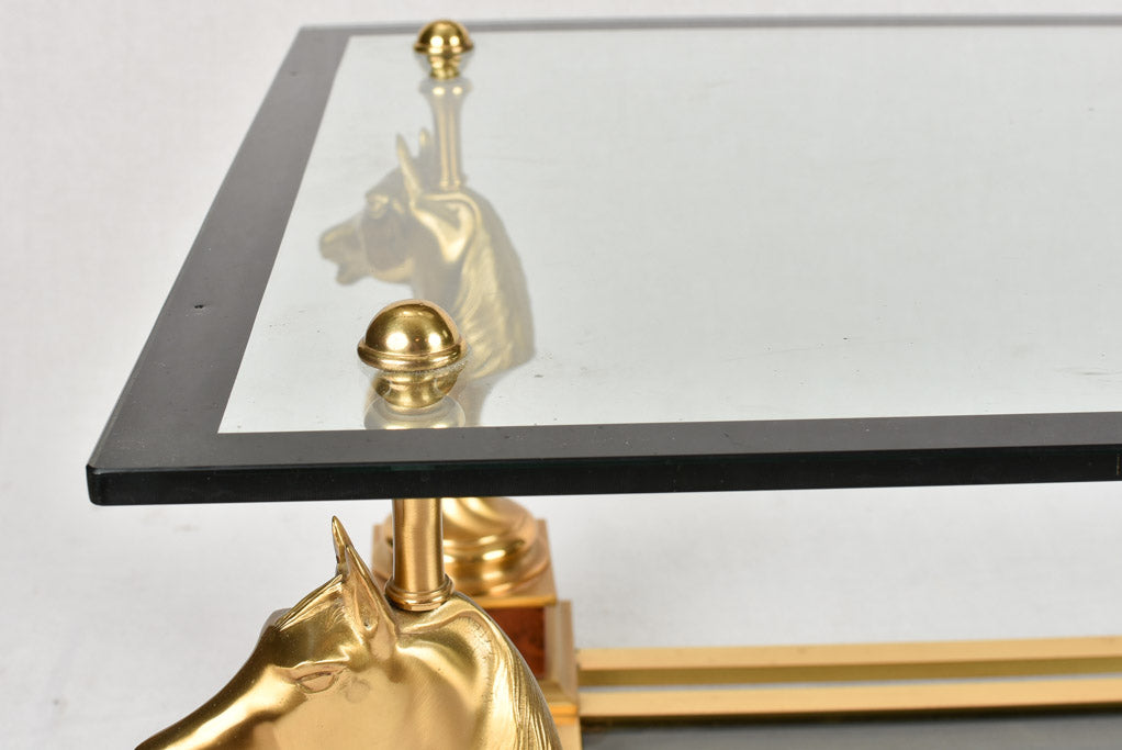 1970s glass coffee table with horse heads 47¾"