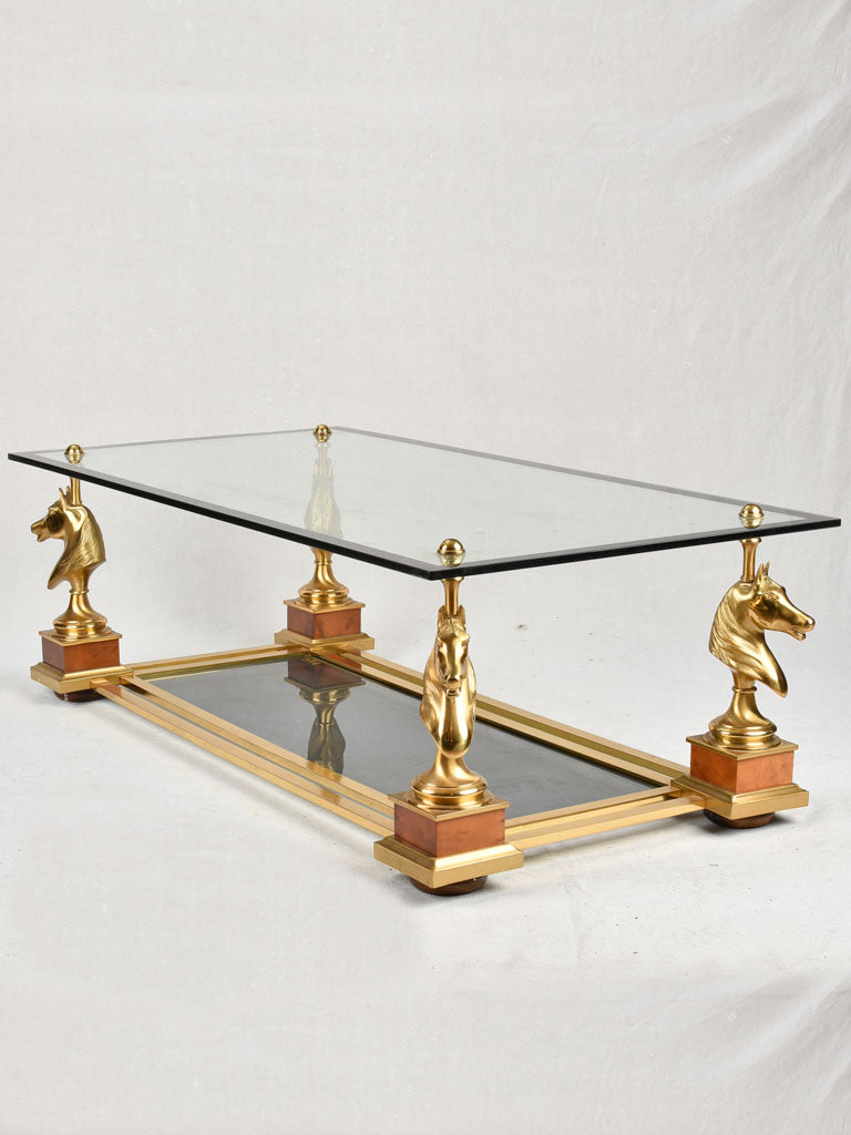 1970s glass coffee table with horse heads 47¾"
