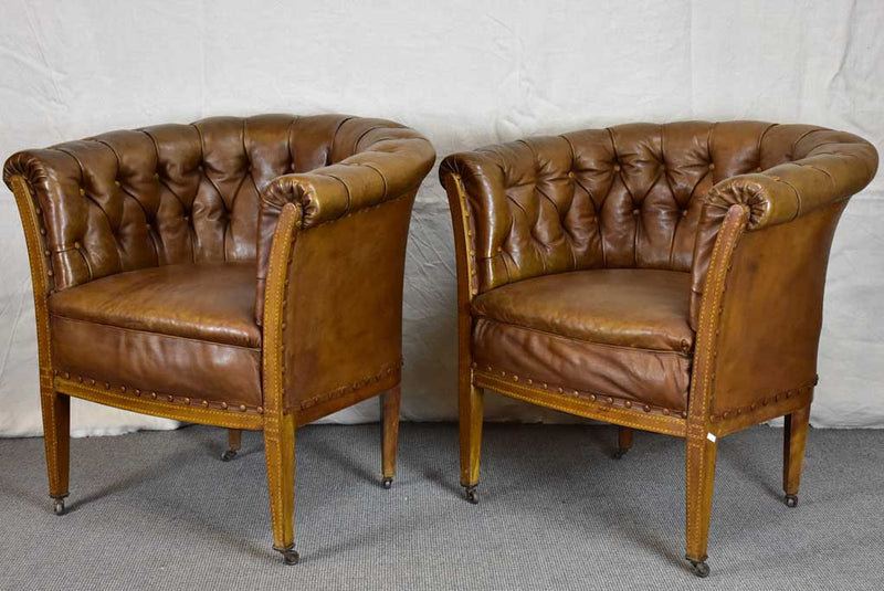 Pair of mid-century English leather armchairs