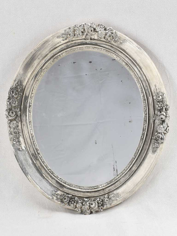 Antique floral-decorated oval vanity mirror