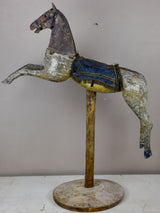 Antique French toy horse mounted on a wooden stand