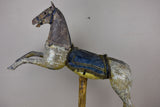 Antique French toy horse mounted on a wooden stand