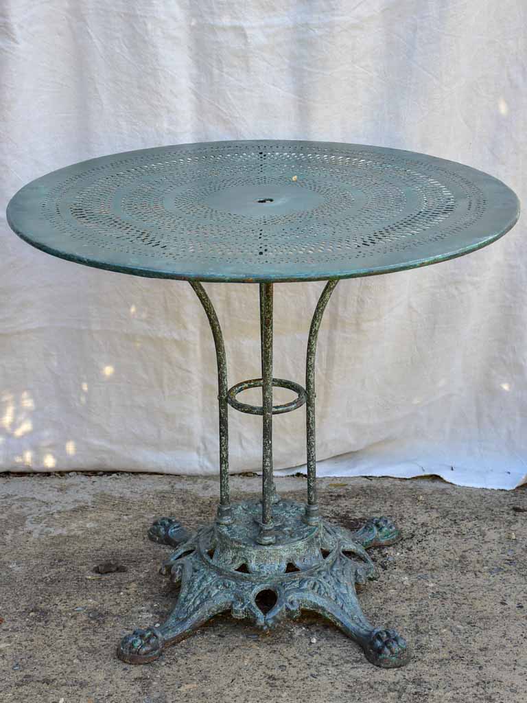 Antique Parisian garden table with three chairs - green