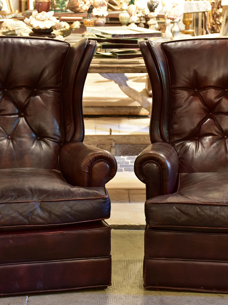 Pair of 1950’s leather wingback armchairs