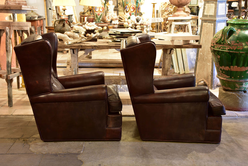 Pair of 1950’s leather wingback armchairs