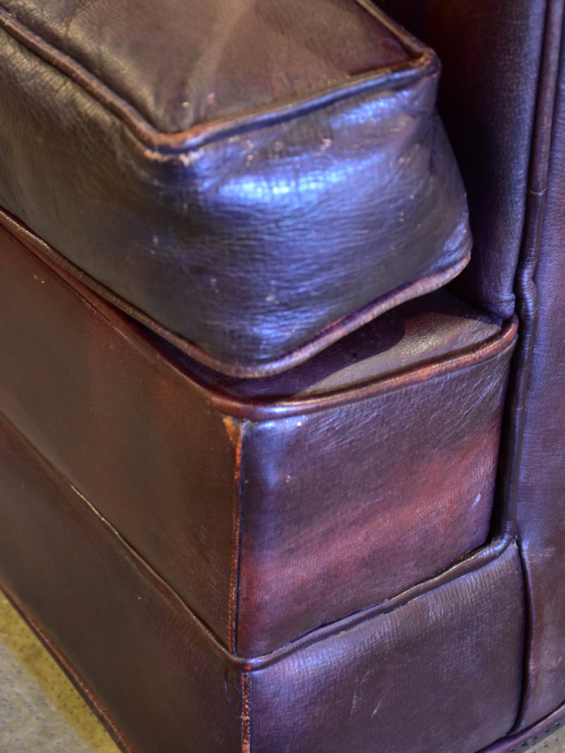 Pair of 1950’s leather wingback armchairs