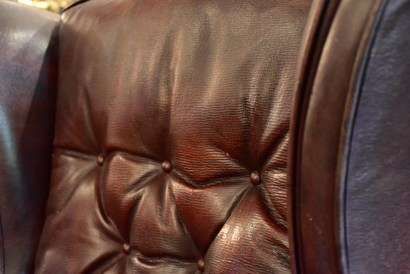 Pair of 1950’s leather wingback armchairs