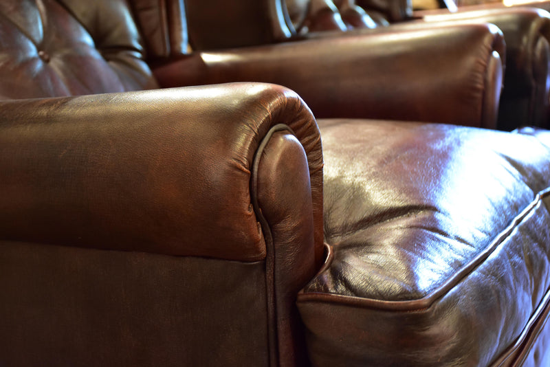 Pair of 1950’s leather wingback armchairs