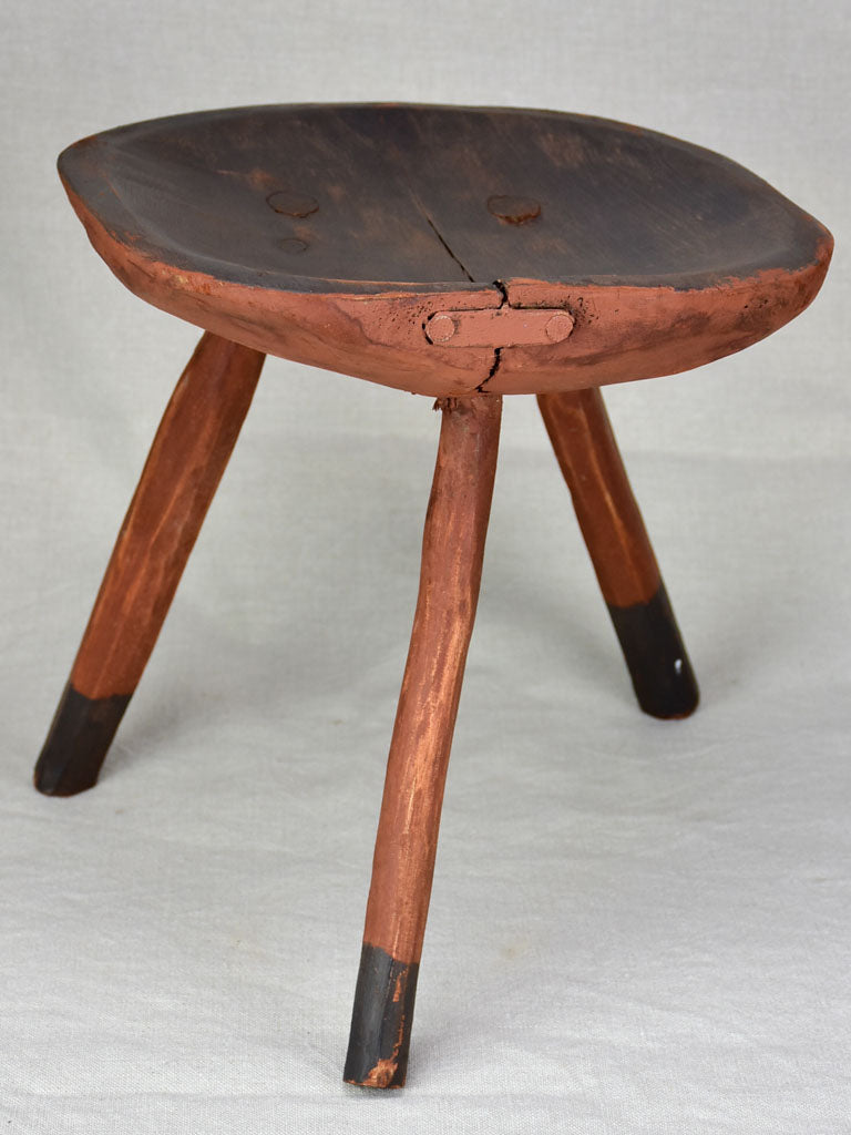 Antique French primitive milking stool with burgundy red paint finish