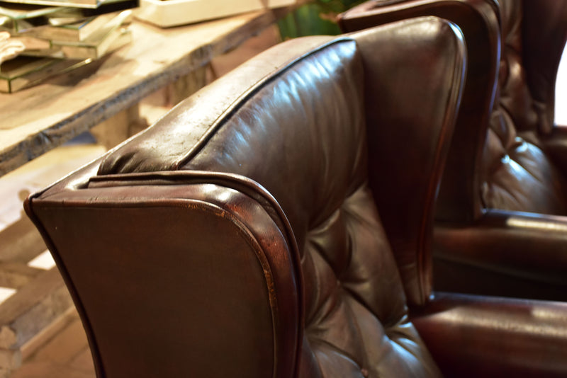 Pair of 1950’s leather wingback armchairs