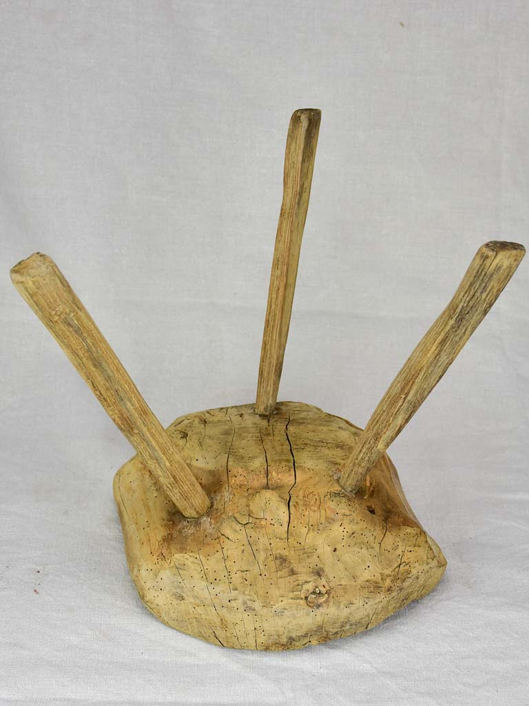 Timeworn antique French primitive milking stool