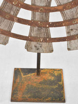 Antique sunburst sculptures on iron base 