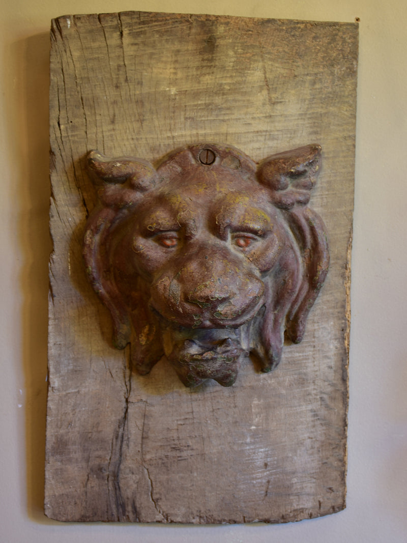 Mounted antique cast iron lion’s head