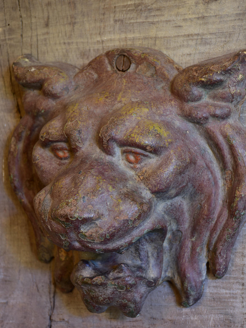 Mounted antique cast iron lion’s head