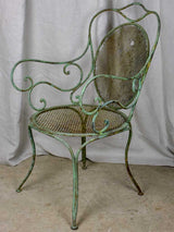 Antique French garden armchair with green patina