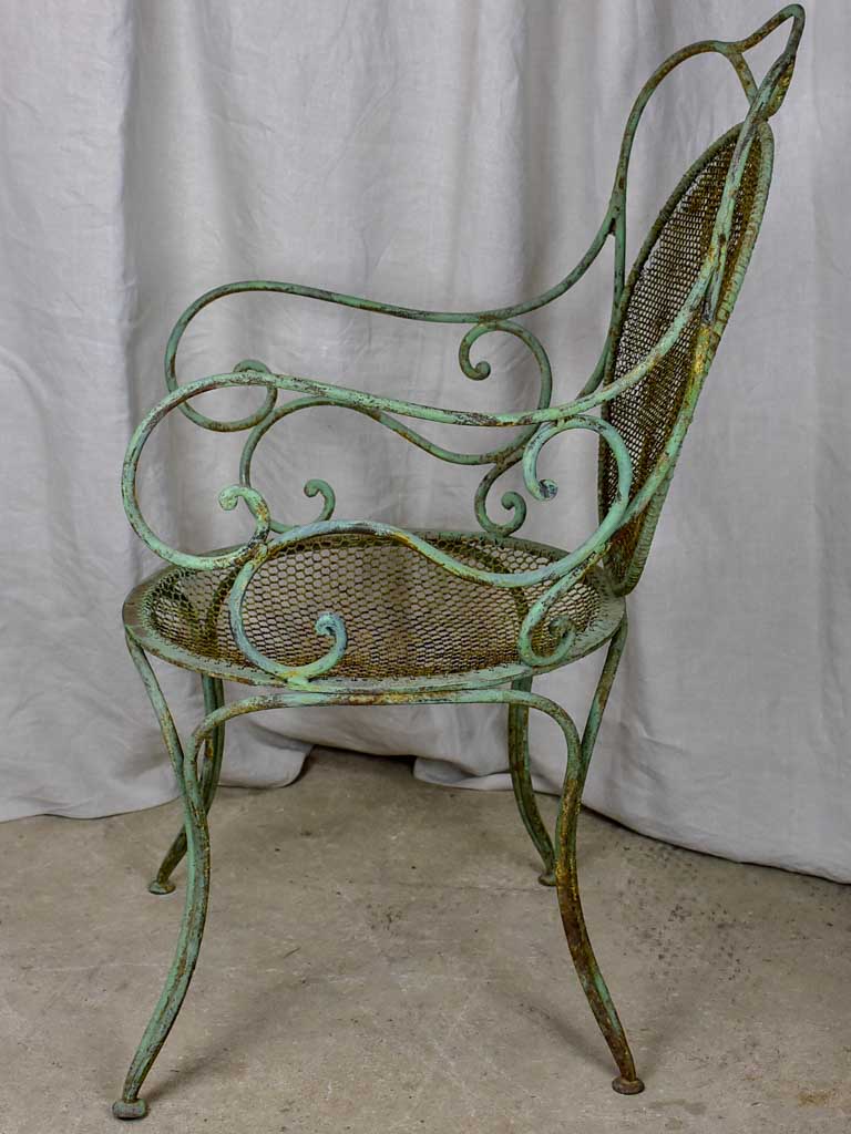 Antique French garden armchair with green patina