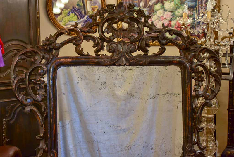 Large late 18th Century carved wood mirror with original black patina and aged glass 45¾" x 63½"
